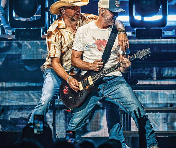 Guitarists on stage at Pinnacle Bank Arena