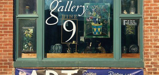 Photo of a window showing a colourful art gallery in Lincoln