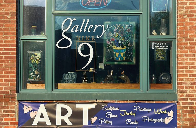 Photo of a window showing a colourful art gallery in Lincoln