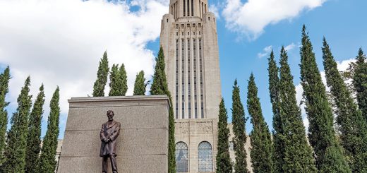 a picture of the Abraham Lincoln statue outside the Nebraska State Capitol building.