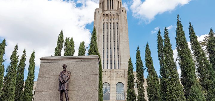 a picture of the Abraham Lincoln statue outside the Nebraska State Capitol building.