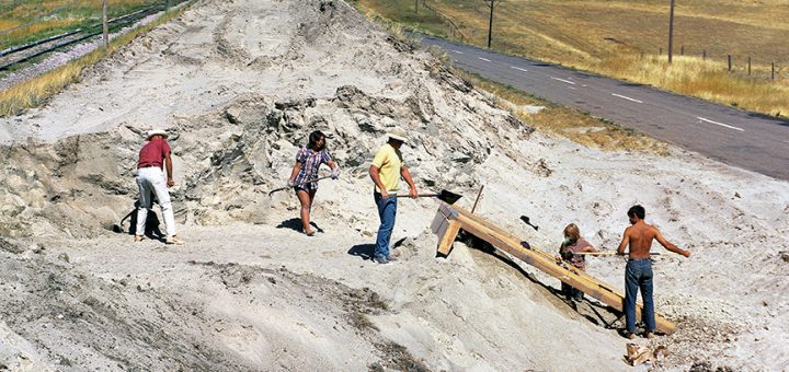 Workers at an archaeological site digging.